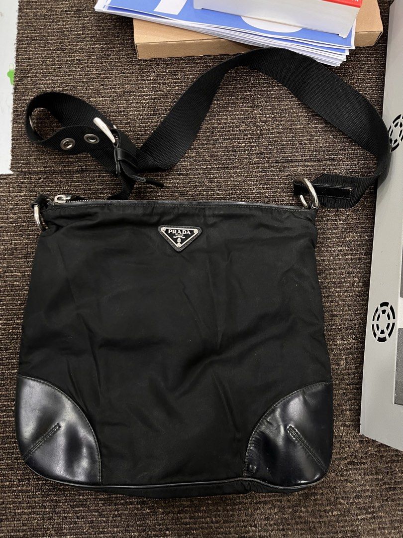 Prada sling bag (Category: Luxury Bags & Wallets) located in Bacolod City. Submitted by hanap_ukay_540 (Listing ID 1465196993, Image 2). Description: Prada tessuto nylon cross body bag Authentic Sign of used only Cut white tag but authentic, check each photo to see the details Location: Bacolod City Negros aocc Unli video call or vouch or smooth and safety transactions Dm me if interested 📥.