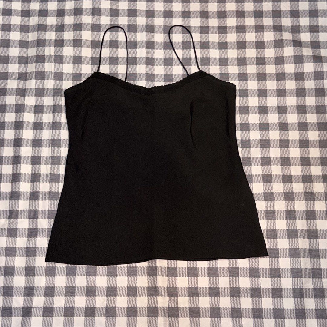PRELOVED- BLACK CAMISOLE TOP 🖤 (Category: Sleeveless) located in Abucay. Submitted by littlefindsbyb (Listing ID 1465381789, Image 1). Description: ✨ PRELOVED BLACK CAMISOLE TOP ✨ Elegant and versatile wardrobe staple — perfect for layering or wearing on its own. Easy to dress up or down for any occasion. 📏 MEASUREMENTS (laid flat): • Chest: ~17–18” • Length: ~16–17” • Fit: Flowy / Relaxed Cut ✨ DETAILS: • Classic black color • Thin spaghetti s