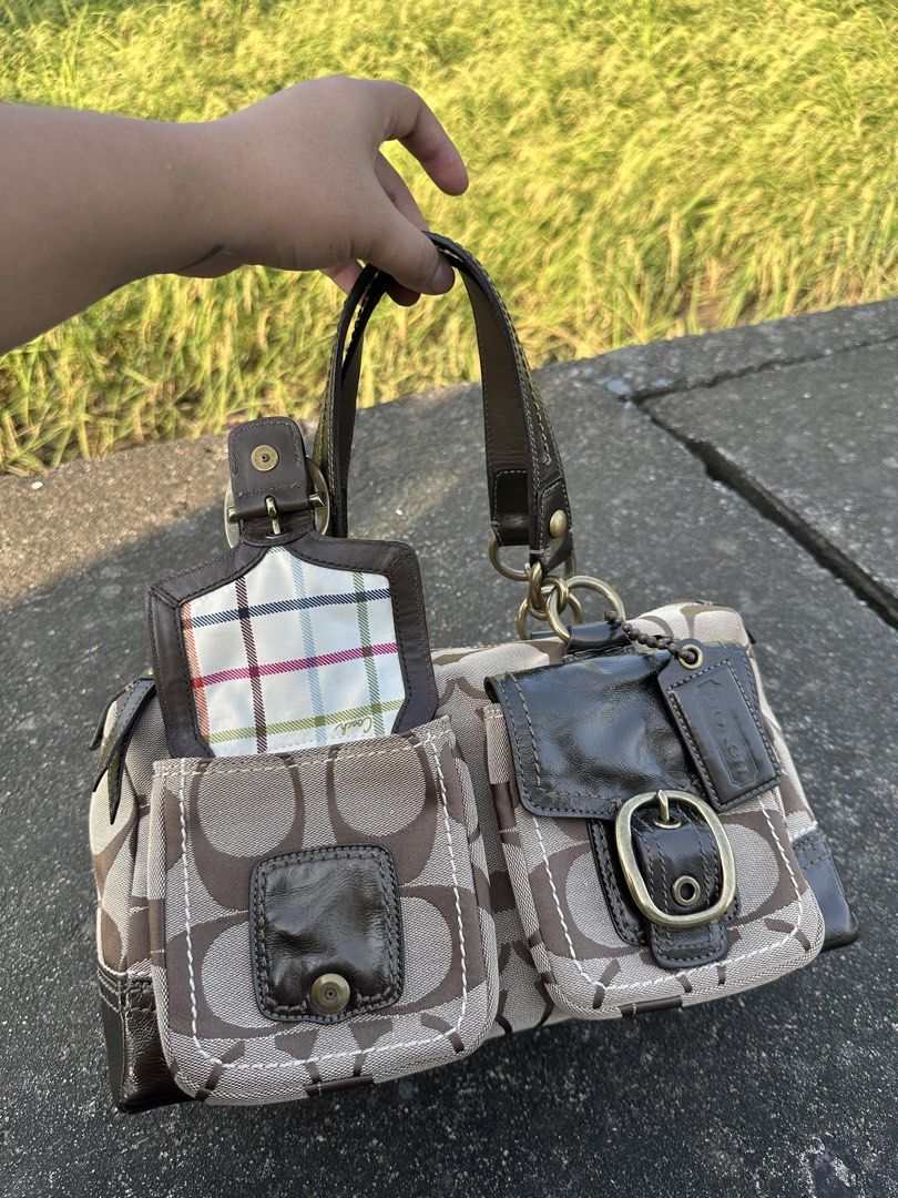 Preloved Coach Bleeker Satchel (Category: Luxury Bags & Wallets) located in Manila. Submitted by glesylbd_22 (Listing ID 1465220193, Image 1). Description: - See last photo for minimal sign of use - No other issues, - Authentic Coach signature canvas handbag in classic brown - Dark patent leather trim, handles, and brass-tone hardware - Two front utility pockets with buckle closures and playful plaid flaps - Colorful plaid interior lining with co