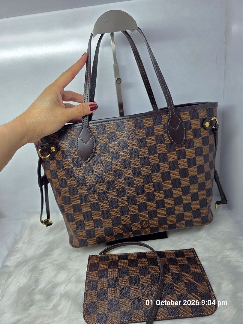 Preloved Louis Vuitton Neverfull Ebene Damier PM Size bag (Category: Luxury Bags & Wallets) located in Antipolo. Submitted by aaliyahs.closet2 (Listing ID 1461589195, Image 3). Description: ALL MUST GO. DECLUTTERING MY PERSONAL BAGS. From Japan Thrift Shop. Self- Authentication. Strictly 2days Reservation Only. Sending Offer means, you are decided to purchase the item. After Offer is ACCEPTED it is automatically Reserved. No returns, no exchanged