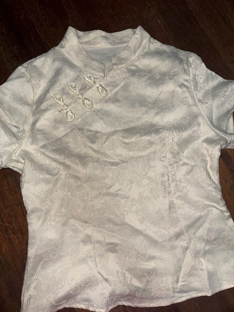 Preloved Shein Chinese Collar Shirt (Category: Shirts) located in Quezon City. Submitted by yochimoto_cart (Listing ID 1465295867, Image 2). Description: - Shein Preloved Shirts: Chinese Collar & Summer with cross-neck lace. Bundle of two shirts for P300 - Only used once in an international trip - Size: both are Large - Rfs: no other occassions to use it for - QC Loc .