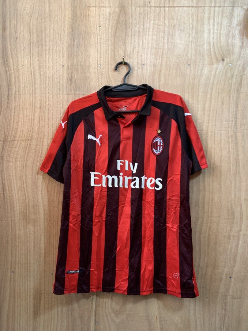 Puma AC Milan Fly Emirates (Category: Activewear) located in Kabasalan. Submitted by alvin_6 (Listing ID 1465197847, Image 1). Description: - Authentic Puma AC Milan home jersey - Iconic red and black vertical stripes design - Fly Emirates front sponsor print with club crest and Puma logo - Stylish collared neck with single-button placket - Number 2 printed on the back - 100% polyester material for comfort and breathability - Standard fit, great 