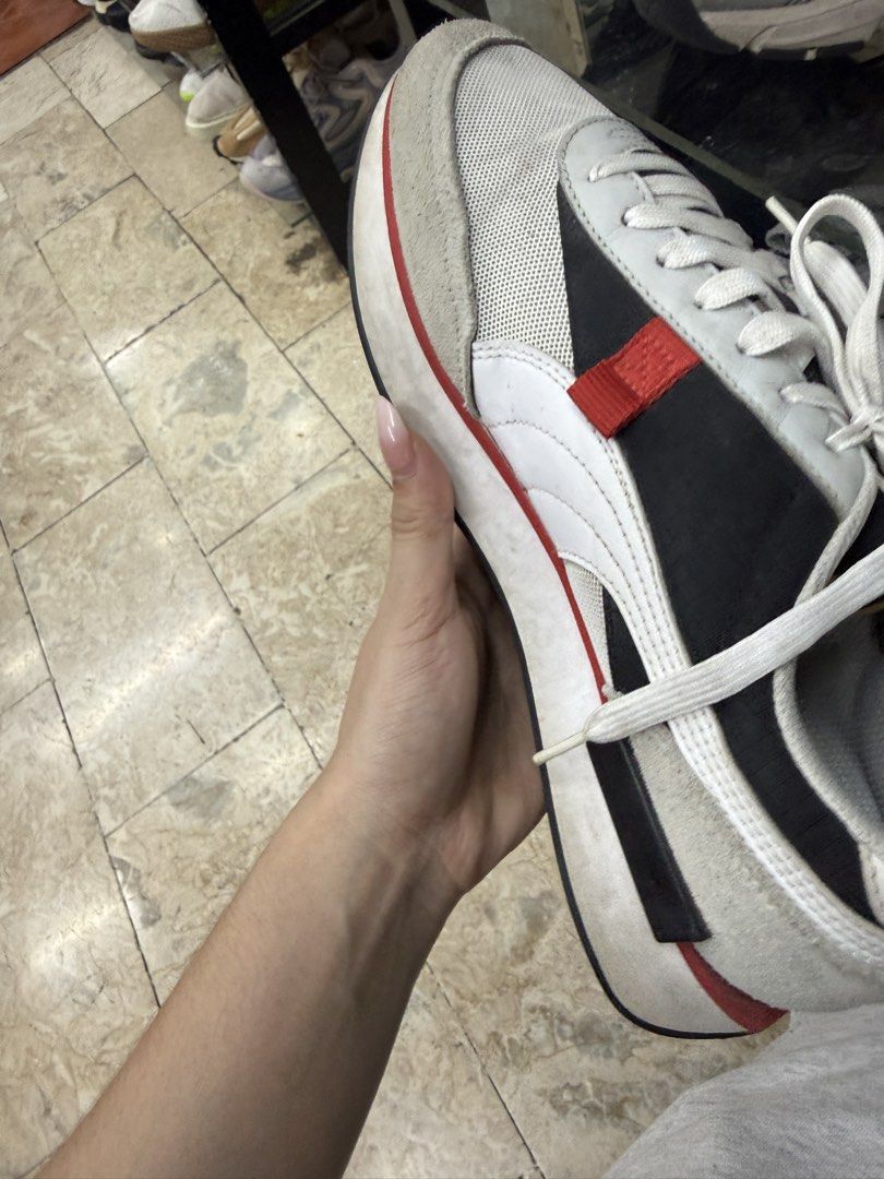 Puma Future Rider Sneakers White Black Red Size UK 8.5 (Category: Sneakers) located in Abucay. Submitted by fastlion.584bdf (Listing ID 1465360708, Image 3). Description: - Brand: Puma - Style: Low top everyday sneakers - Colorway: White, black, and grey with red accents - Materials: Mesh and suede upper panels, classic white laces - Details: Puma branding on side, tongue, and heel counter - Size: UK 8.5 / EUR 42.5 - Condition: Pre-loved with vis