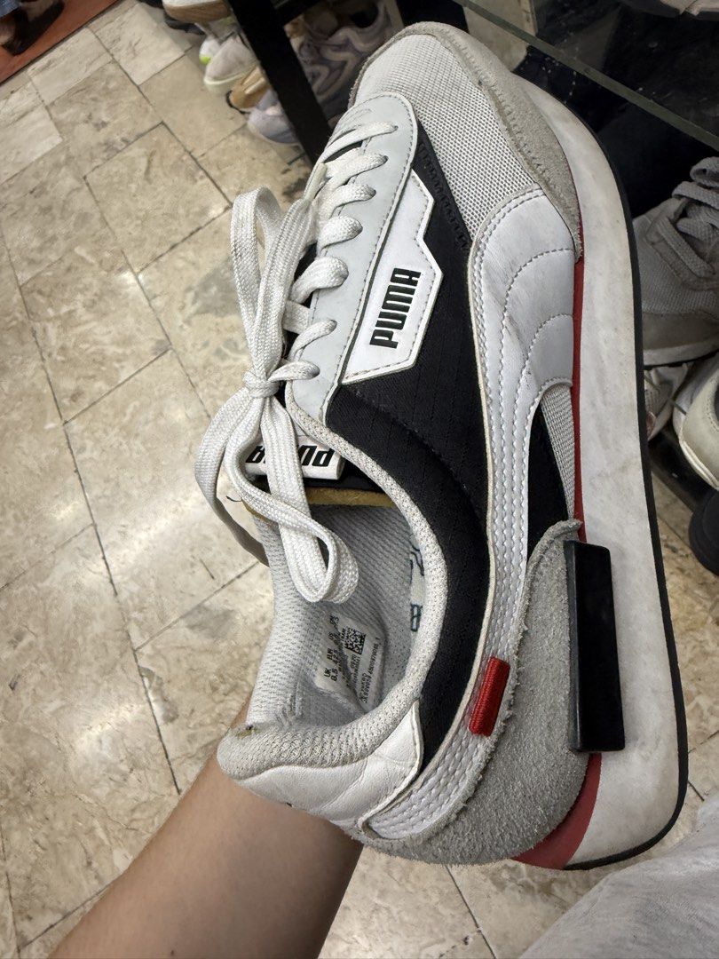 Puma Future Rider Sneakers White Black Red Size UK 8.5 (Category: Sneakers) located in Abucay. Submitted by fastlion.584bdf (Listing ID 1465360708, Image 1). Description: - Brand: Puma - Style: Low top everyday sneakers - Colorway: White, black, and grey with red accents - Materials: Mesh and suede upper panels, classic white laces - Details: Puma branding on side, tongue, and heel counter - Size: UK 8.5 / EUR 42.5 - Condition: Pre-loved with vis