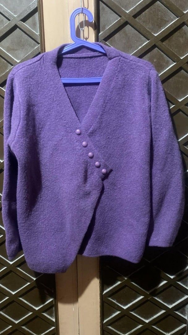 Purple Wrap Knit Cardigan with Diagonal Buttons (Category: Coats, Jackets and Outerwear) located in Tarlac. Submitted by jieunieee (Listing ID 1465193133, Image 1). Description: - Style: Purple knitted cardigan with a unique wrap-over front - Closure: Diagonal front fasten with 5 matching round buttons - Material & Feel: Soft, fuzzy texture all over, clean knit - Fit & Details: Deep V-neckline and long sleeves - Condition: Excellent, no pulls or 