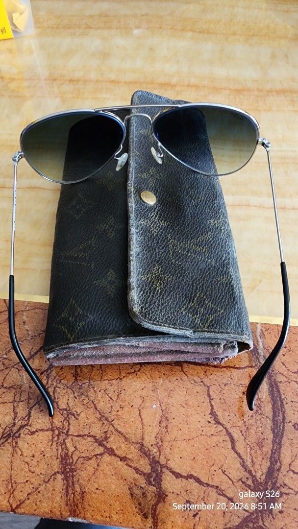 Rayban 3025 LENSES GREY GRADIENT (Category: Sunglasses & Eyewear) located in Caloocan City. Submitted by fernandezr29382 (Listing ID 1465186455, Image 1). Description: - Brand: Ray-Ban - Model: RB3025 Aviator - Frame Color: Silver Metal - Lenses: grey gradient - Size: 58-14 (stamped on bridge) - Inclusion: Vintage Louis Vuitton monogram leather case with snap button closure - Condition Note: Sunglasses are in classic style; the LV case shows heav