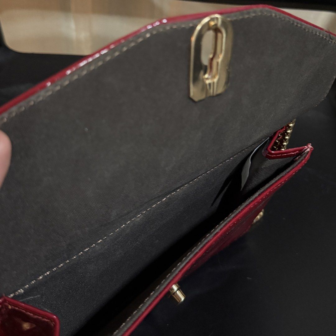 Red Adjustable Crossbody Bag with Gold Chain (Category: Cross-body Bags) located in Makati City. Submitted by julyco. (Listing ID 1465358857, Image 3). Description: - double flap - Eye-catching bright red patent leather with stylish quilted chevron front flap - Premium gold-tone hardware featuring a chic chunky chain strap - Secure and easy-to-use twist-lock front closure - Dark fabric-lined interior with multiple compartments to keep you organiz