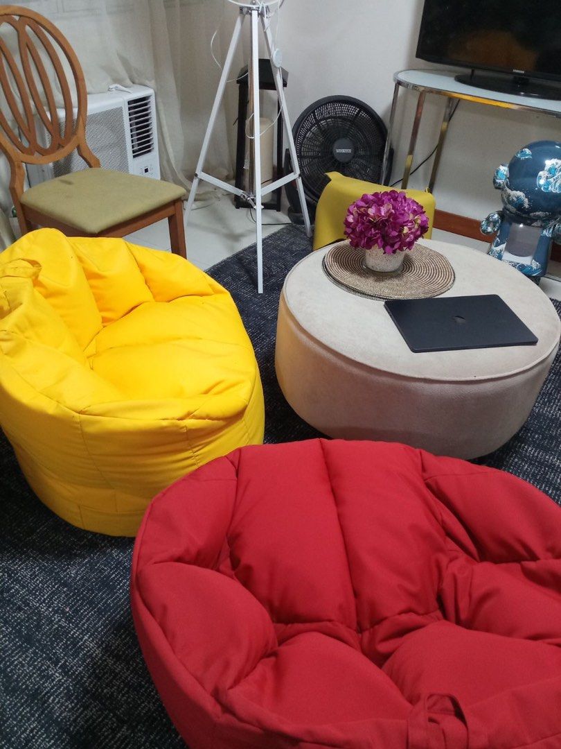 Red Bean Bag Chair Soft Lounge Seat (Category: Chairs) located in Makati City. Submitted by kdclueless (Listing ID 1465196341, Image 2). Description: - Color: 2 red 2 yellow 2 blue - Condition: Clean and durable fabric - Comfort: Stuffed full and very plush - Design: Deep bucket shape for great back support - Versatility: Perfect for living rooms, bedrooms, or reading nooks, and easy to move around.