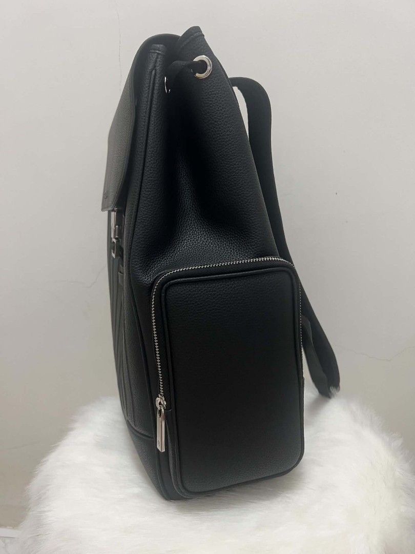 RIMOWA Black Leather Backpack (Category: Backpacks) located in Paoay. Submitted by rvf1230 (Listing ID 1465207589, Image 3). Description: - Brand: Rimowa - Material: Premium black grained leather with silver-tone hardware - Closure: Secure front buckle with flap top design - Storage: Two side zippered pockets and a clean interior layout - Comfort: Padded, adjustable shoulder straps and breathable mesh back panel - Portability: Convenient top hand
