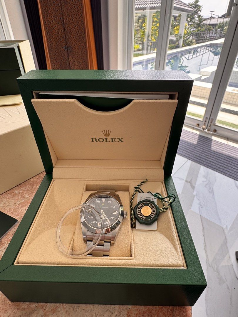 Rolex Air-King Watch Box Papers (Category: Luxury Watches) located in Quezon City. Submitted by jamescarlos_2025 (Listing ID 1465176830, Image 3). Description: - Authentic Rolex Air-King pilot watch - Durable stainless steel case with iconic black dial and prominent Arabic numerals - Classic Oyster bracelet - Reliable automatic movement - Complete set: Green presentation box, outer box, green hang tag, serial tag, and warranty card in leather sle