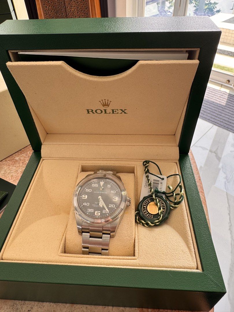 Rolex Air-King Watch Box Papers (Category: Luxury Watches) located in Quezon City. Submitted by jamescarlos_2025 (Listing ID 1465176830, Image 2). Description: - Authentic Rolex Air-King pilot watch - Durable stainless steel case with iconic black dial and prominent Arabic numerals - Classic Oyster bracelet - Reliable automatic movement - Complete set: Green presentation box, outer box, green hang tag, serial tag, and warranty card in leather sle