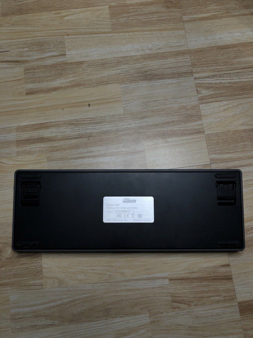 Royal Kludge RK R65 (Category: Computer Keyboard) located in Manila. Submitted by jshmnl (Listing ID 1465359525, Image 3). Description: — 65% — Not wireless/Cable not included — Customization: Mixed keycaps — Connectivity: Wired (type c cable not included) — Brown switch — Condition: Unleveled keyboard stand and dusty but fully functional.