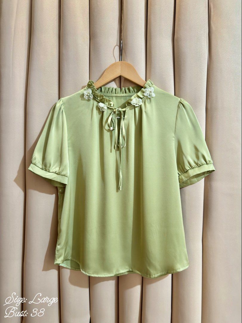 Ruffle Tie-Neck Blouse (Category: Blouses) located in Manila. Submitted by glamstylemnl (Listing ID 1465317978, Image 1). Description: ♡ SIZE: L ♡ BUST: 38 ♡ Swipe left to see the actual color & details ♡ ruffled neckline / floral applique details / tie-neck closure ♡ HQ • 10/10 ♡ Ready to wear 👚.