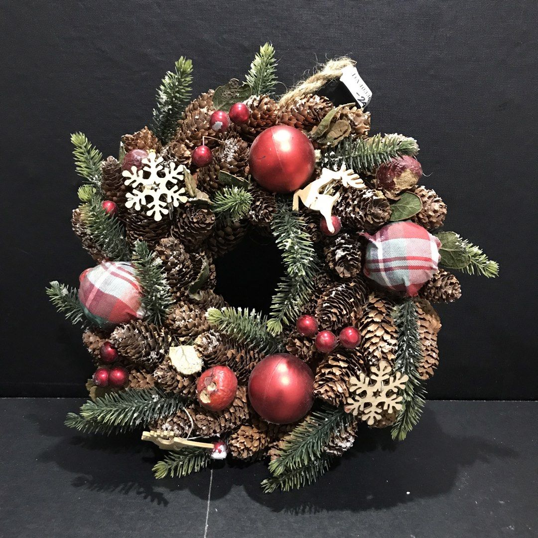 Rustic Christmas Pinecone Wreath with Plaid Ornaments (Category: Wall Decor) located in Baao. Submitted by all.things.japan (Listing ID 1465306696, Image 1). Description: 9.5 inches/24.0 cm diameter - Beautiful holiday wreath made with natural pinecones and evergreen needles - Decorated with shiny red baubles, plaid fabric balls, wooden snowflakes, and a charming wooden reindeer - Accented with scattered small red berries for a festive touch - St