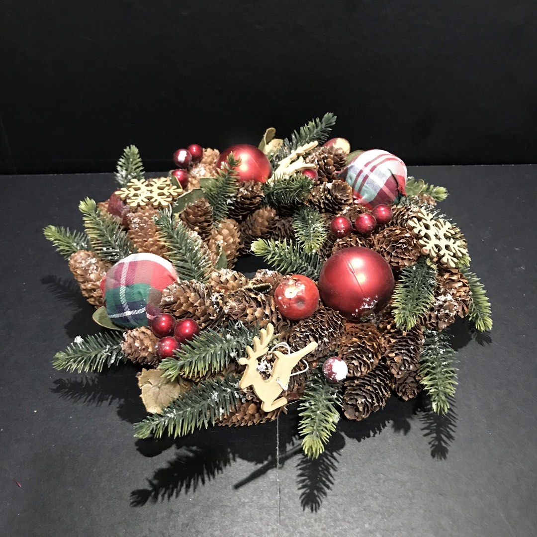Rustic Christmas Pinecone Wreath with Plaid Ornaments (Category: Wall Decor) located in Baao. Submitted by all.things.japan (Listing ID 1465306696, Image 3). Description: 9.5 inches/24.0 cm diameter - Beautiful holiday wreath made with natural pinecones and evergreen needles - Decorated with shiny red baubles, plaid fabric balls, wooden snowflakes, and a charming wooden reindeer - Accented with scattered small red berries for a festive touch - St