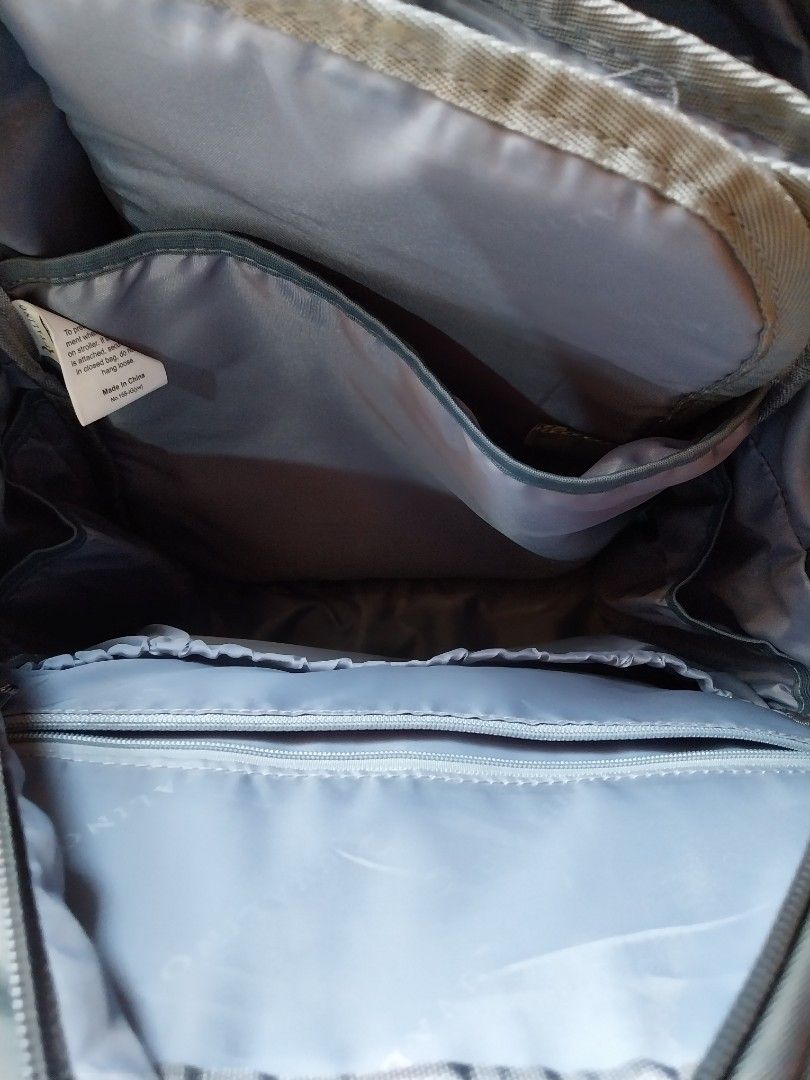 Ruvalino Multifunction Diaper Backpack Model YW168-IG (Category: Backpacks) located in Manila. Submitted by j.dlh (Listing ID 1465181011, Image 3). Description: - Brand/Model: Ruvalino YW168-IG - Color: Grey nylon with stylish brown leather-look accents - Storage: Roomy interior featuring multiple organization pockets, zippered compartments, and elasticated pouches - Versatile Carry: Dual adjustable shoulder straps and convenient top grab handles
