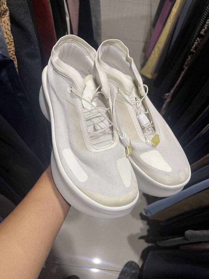 Salomon White Chunky Sneakers (Category: Sneakers) located in Cavite. Submitted by thriftkicks3 (Listing ID 1465282756, Image 2). Description: - Brand: Salomon sneakers in crisp white - Design: Modern chunky platform sole with a clean silhouette - Features: Breathable mesh upper and convenient quick-lace system - Branding: Stamped on the heel counter - Condition: Minor yellowing near some seams and light scuff marks on the soles.