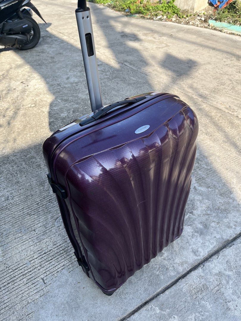 Samsonite Spinner Hard Shell Suitcase Purple (Category: Luggage) located in Manila. Submitted by batusaipus03057 (Listing ID 1465314679, Image 2). Description: - Brand: Samsonite Cosmolite Spinner - Color: Rich purple hard shell - Mobility: 4 smooth-rolling spinner • Line: Cosmolite • Material: Curv® woven polypropylene (lightweight and impact-resistant) • Design: Molded shell lines inspired by seashells With passcode Minor Scratches May maliit l
