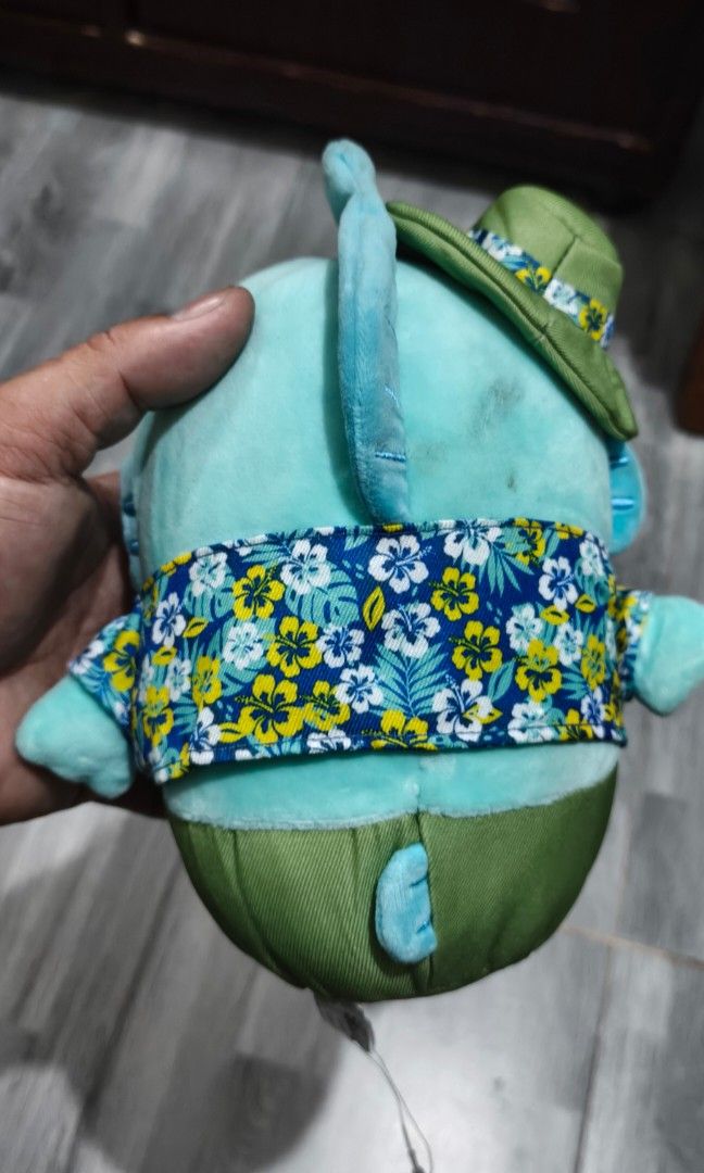 Sanrio Collab Hangyodon (Category: Designer & Blind Box Toys) located in Caloocan City. Submitted by cogeothriftapparel (Listing ID 1465296140, Image 2). Description: Limitted ! Sanrio collaboration plush of the character Hangyodon wearing an Amazon Express-themed floral shirt and a matching green hat..