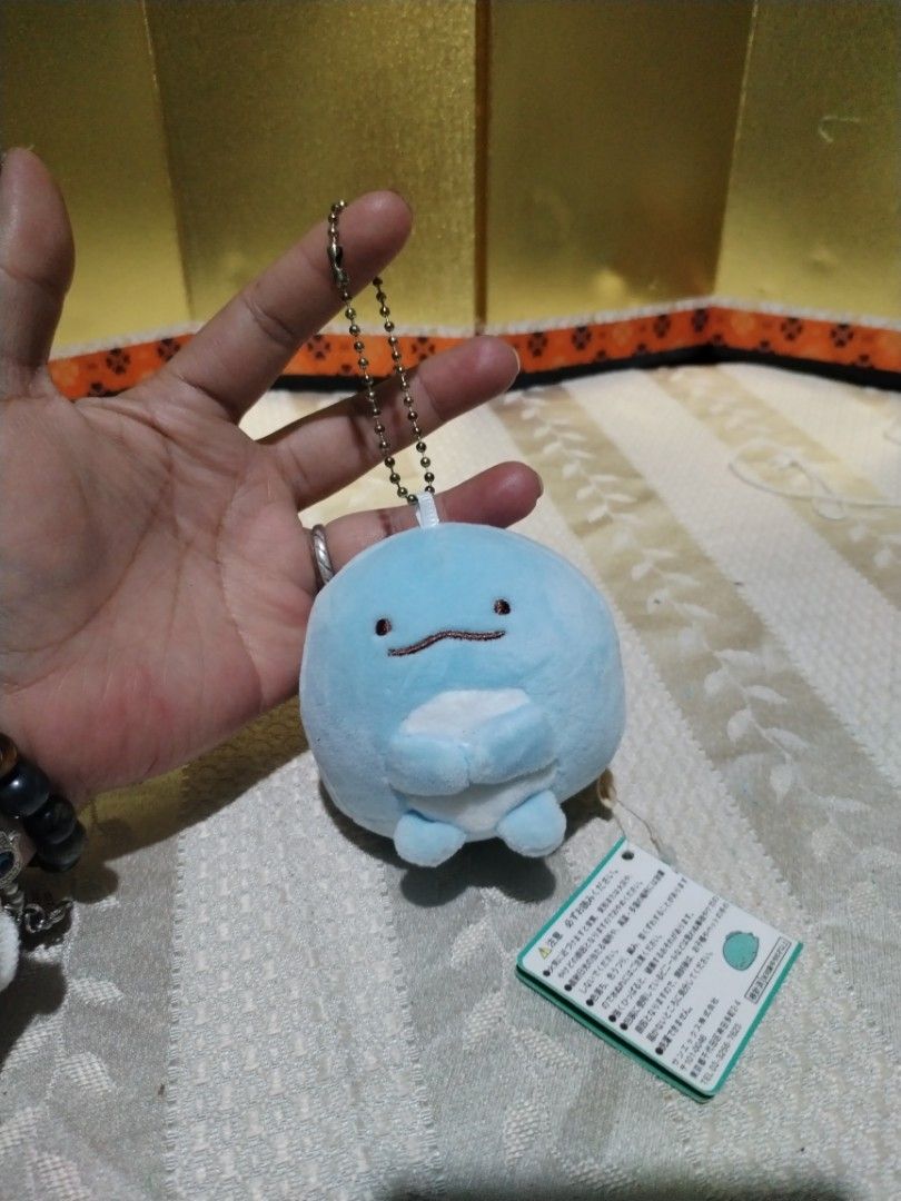 San-X Sumikko Gurashi Plush Keychain 89each (Category: Plushies & Soft Toys) located in La Trinidad. Submitted by malditas (Listing ID 1465335906, Image 3). Description: - Authentic San-X Sumikko Gurashi plush keychain set - Includes 3 characters: Penguin (with watermelon), Tokage (blue), and Neko (cream) - Soft fabric material with gold ball chains for bags or keys - Original paper tags and tush tags still attached - Brand new and in pristine co