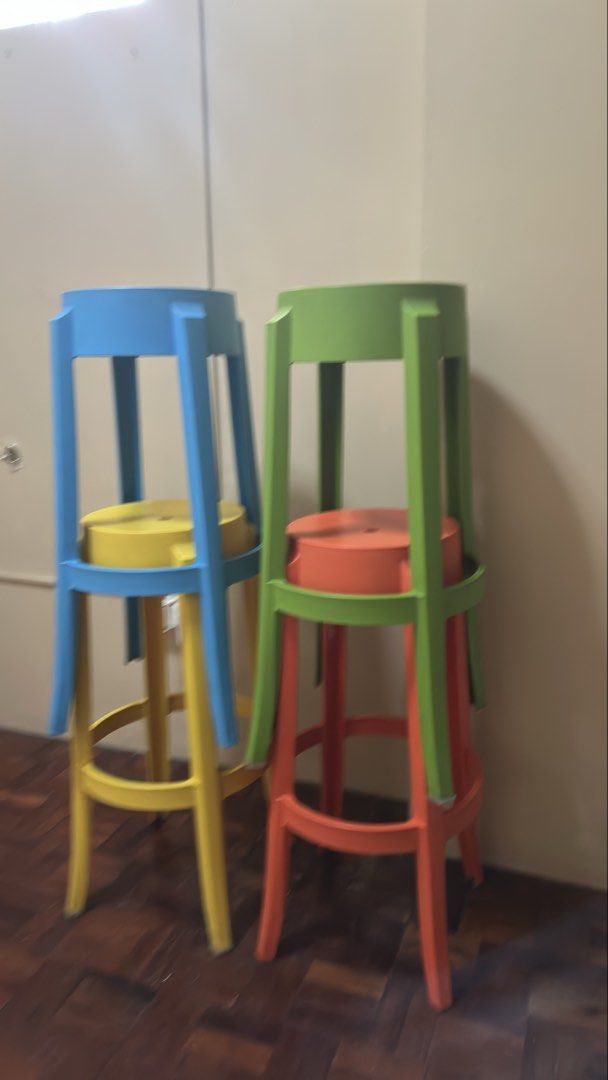 Set of 4 colorful bar stools (Category: Chairs) located in Mandaluyong City. Submitted by joanietoniengy (Listing ID 1465293738, Image 2). Description: Set of four tall bar stools in bright, vibrant colors. Includes orange, blue, green, and yellow. Sturdy plastic construction with footrests built around the legs. Great for kitchen islands, home bars, or breakfast counters. Modern design, easy to stack when you need extra space. Selling all four t