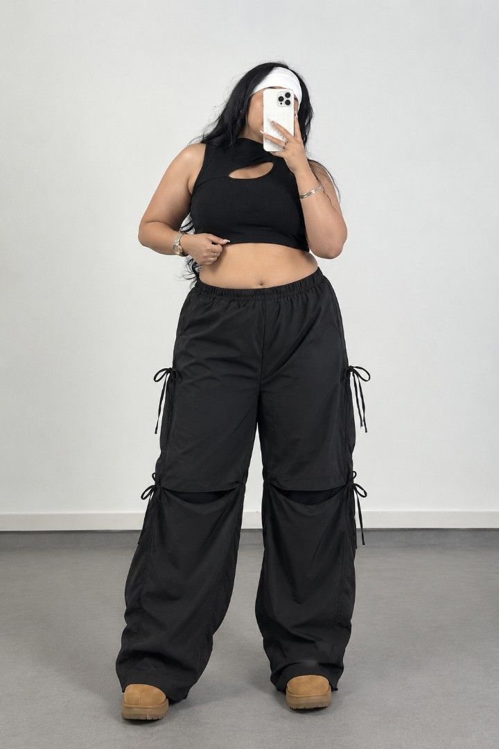 SHEIN Curve Black Cargo Parachute Pants (Category: Jeans) located in Manila. Submitted by babeboxtheory (Listing ID 1465214891, Image 1). Description: - Brand: SHEIN Curve - Size: 4XL - Color: Black - Material: Lightweight parachute fabric - Fit: Comfy elastic waist with a trendy wide-leg cut - Details: Adjustable drawstrings at sides and knees, plus unique lower leg slits - Style: Ultimate streetwear piece that pairs easily with crop tops or ove