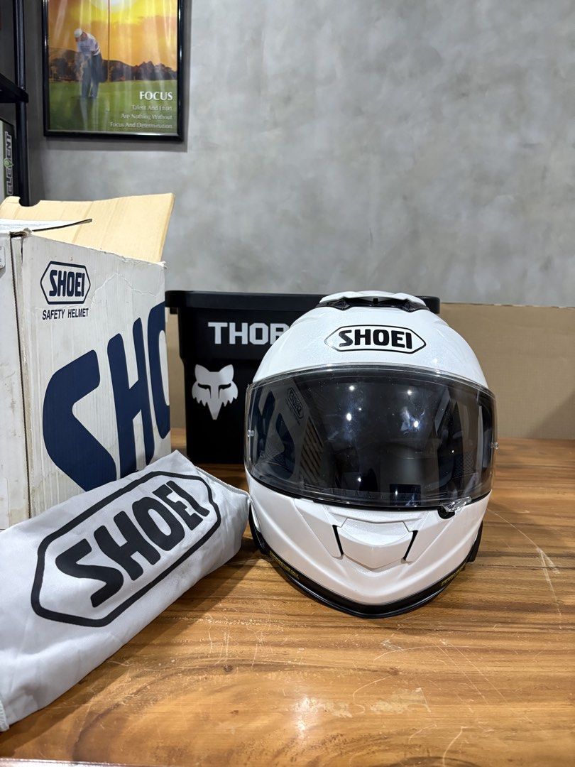 Shoei White Full Face Motorcycle Helmet with Box (Category: Caps & Hats) located in Valenzuela. Submitted by crvzthrift (Listing ID 1465201246, Image 1). Description: Item: Shoei GT-Air 2 Mono Helmet Color: Luminous White Size: XL (61-62cm) Type: Full-face helmet SRP: Php 36,500 Asking: 30000 negotiable Note: With box and bag (used once).