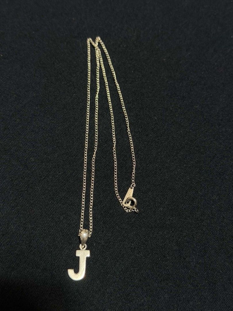 Silver 925 Necklace with J Initial Letter Pendant (Category: Necklaces) located in Abucay. Submitted by thrifty.picked (Listing ID 1465359827, Image 1). Description: - Silver 925 chain necklace with matching letter J pendant - Standard link chain style with secure spring ring clasp - Sleek and minimalist design for versatile, everyday styling - Standard length, perfect for layering or wearing on its own - Brand new and ready to ship!.
