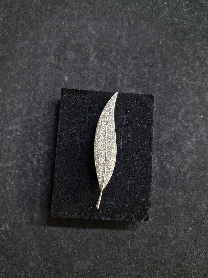 Silver-Tone Leaf Brooch (Category: Brooches) located in Taguig. Submitted by mommaschoice (Listing ID 1465344268, Image 2). Description: Brand New Lightweight won't damage the fabric Adorned w/ silver rhinestones Silver-tone finish Ships nationwide.