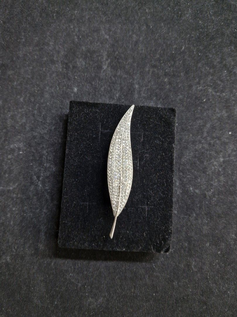 Silver-Tone Leaf Brooch (Category: Brooches) located in Taguig. Submitted by mommaschoice (Listing ID 1465344268, Image 1). Description: Brand New Lightweight won't damage the fabric Adorned w/ silver rhinestones Silver-tone finish Ships nationwide.