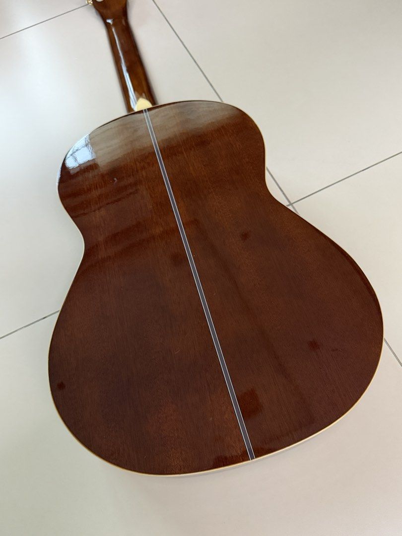 Skywing Classical Guitar (Category: Musical Instruments) located in Manila. Submitted by shopandscore (Listing ID 1465266398, Image 3). Description: - Brand: Skywing - Type: Acoustic classical guitar with standard scale length - Strings: Traditional nylon strings with tie-block bridge setup - Design: Slotted headstock with white tuning keys and gold-plated hardware - Aesthetics: High gloss finish, decorative rosette inlay around soundhole, and ri