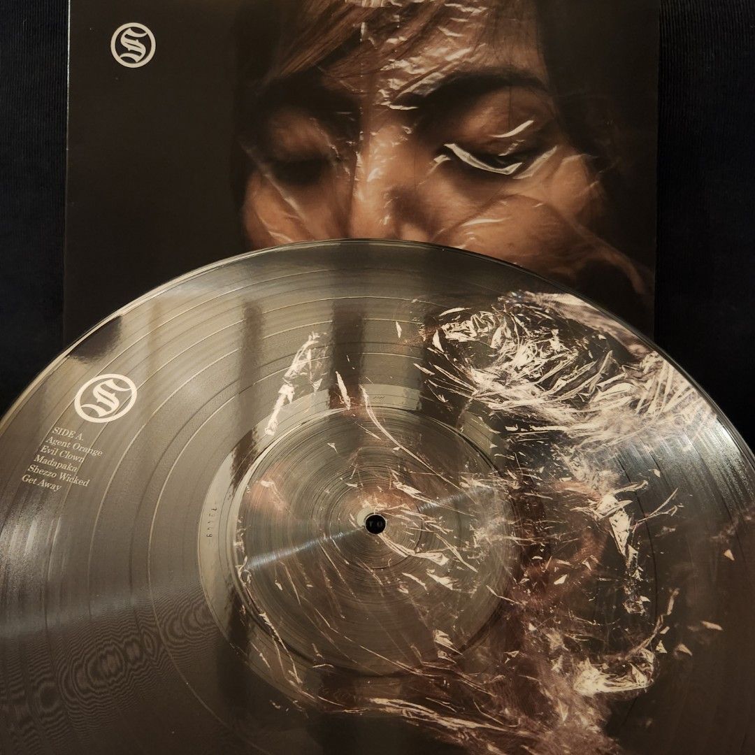 Slapshock - Twelve Point One Vinyl Record LP (Category: Vinyls) located in Caloocan City. Submitted by Secondhand_Sureshots (Listing ID 1465275953, Image 3). Description: - Artist/Album: Slapshock - Twelve Point One - Format: Rare Clear Vinyl (PolyEast Records) - Tracklist includes: Agent Orange, Evil Clown, Madapaka, Shezzo Wicked, Get Away, Wake Up, Queen Paranoia, Numb, We Are One, and Miles Away - Condition: Played only a couple of times, sou