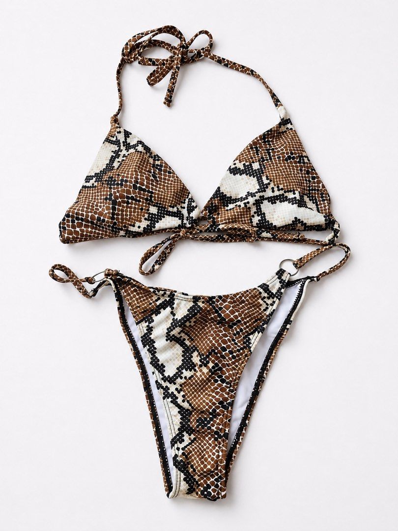 Snake Print Bikini Set Halter Triangle Top (Category: Bikinis & Swimsuits) located in Manila. Submitted by ynaamo (Listing ID 1465263908, Image 1). Description: - Style: Wild snake print two-piece swimsuit - Top: Halter neck triangle top with adjustable ties - Bottoms: High-cut with stylish small metal ring details on the sides - Lining: White interior lining - Condition: Brand new, never worn (tags removed, properly stored in closet) - Perfect f