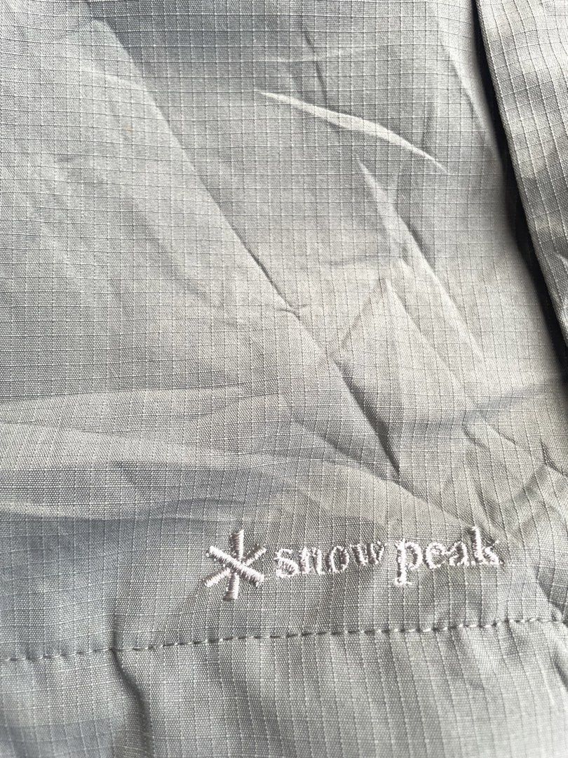 Snow Peak FR Stretch Jacket (Category: Coats, Jackets and Outerwear) located in Manila. Submitted by jarchive (Listing ID 1465265358, Image 3). Description: - Good condition - Color rate 7/10 - Need wash - Size large - 20 width - 27 length - Material Composition: 95% Polyester, 5% Aramid (with a 100% Polyester lining) - Key Feature: Flame-retardant property combined with comfortable stretch fabric - Design Details: Full-zip front, elastic cuffs, 