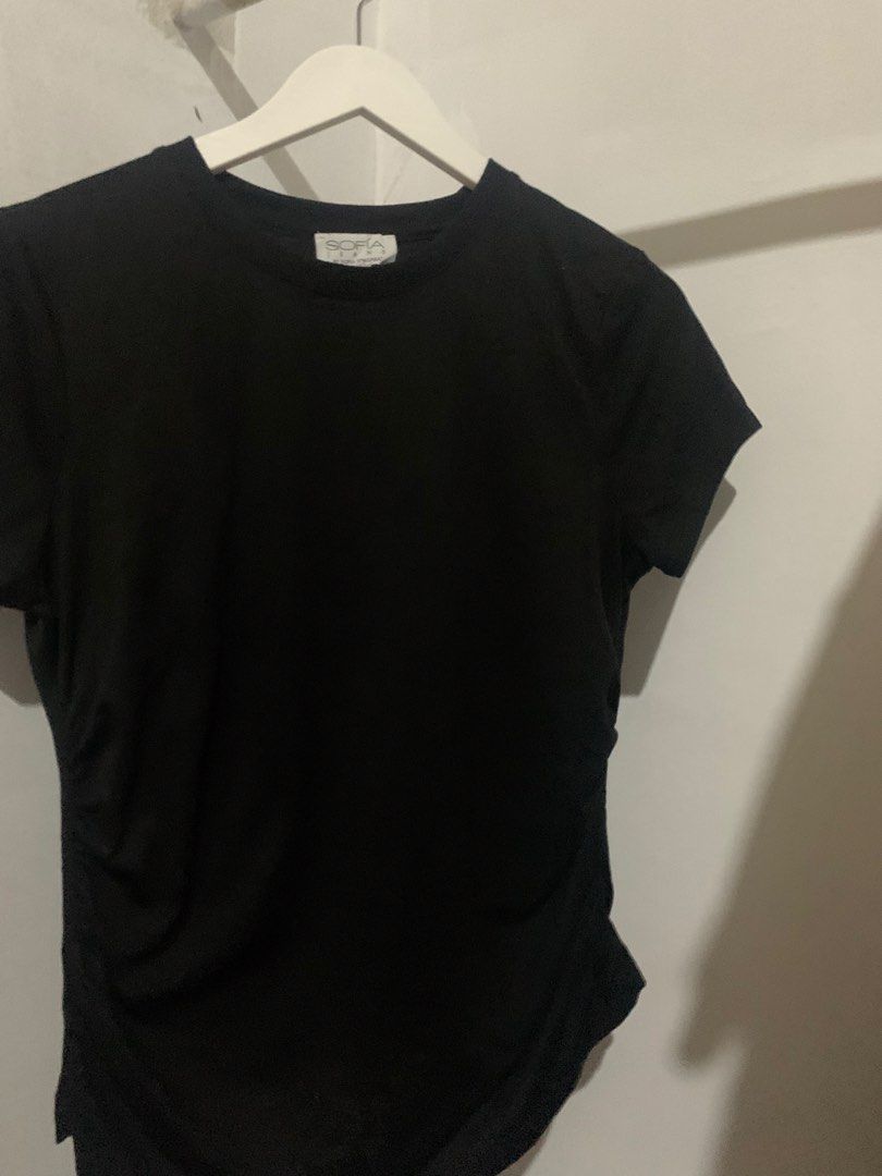 Sofía Jeans by Sofía Vergara Black Tee (Category: Shirts) located in Manila. Submitted by spaceshop12345 (Listing ID 1465309433, Image 3). Description: - Brand: Sofía Jeans by Sofía Vergara - Color: Classic black - Style: Short-sleeve crewneck tee - Fit: Classic fit with a round neckline - Fabric: Super soft and comfortable - Condition: Clean and ready to wear - Versatile: Easy to pair with jeans or skirts.