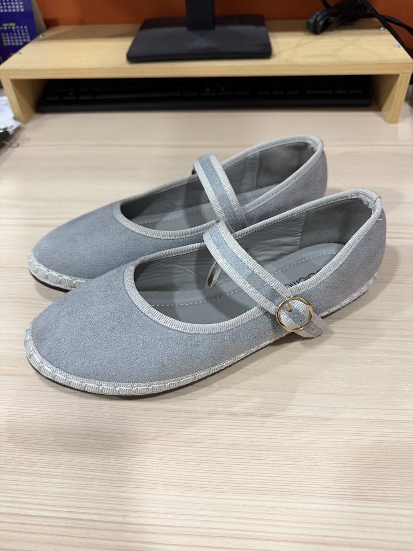 Solemate Grey Mary Jane Flats (Category: Flats & Sandals) located in San Mateo. Submitted by septizel (Listing ID 1465271104, Image 1). Description: - Brand: Solemate - Style: Grey Mary Jane flats - Material: Soft faux suede with contrast trim - Details: Ankle strap with gold buckle, espadrille-style stitching around the base.