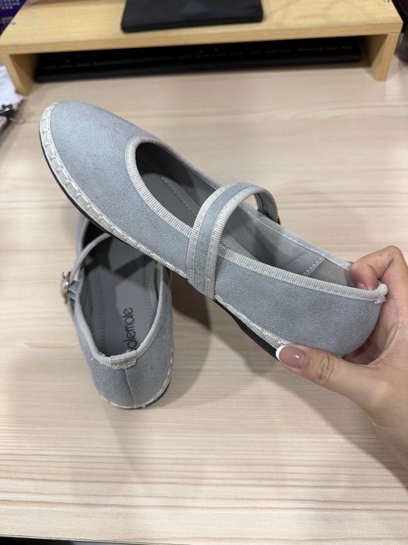 Solemate Grey Mary Jane Flats (Category: Flats & Sandals) located in San Mateo. Submitted by septizel (Listing ID 1465271104, Image 2). Description: - Brand: Solemate - Style: Grey Mary Jane flats - Material: Soft faux suede with contrast trim - Details: Ankle strap with gold buckle, espadrille-style stitching around the base.