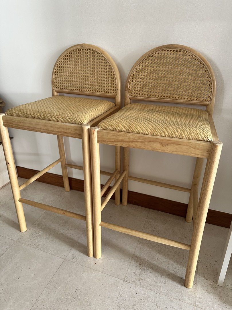 Solid Wood Bar Stools (Category: Chairs) located in Singapore. Submitted by zeesells123 (Listing ID 1465254682, Image 2). Description: - Set of 2 solid wooden bar stools - Natural light wood finish - Woven rattan seats & arched cane backs - Very aesthetic and strong - Sitting height 65-67cm. - $90 for each chair. Must buy as a pair. .