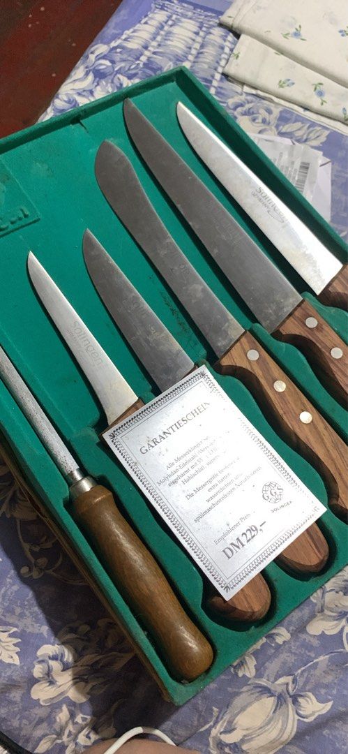 Solingen German Knife Set with Sharpening Steel and Case (Category: Knives & Chopping Boards) located in Manila. Submitted by vrsd1027 (Listing ID 1465266005, Image 2). Description: - Genuine Solingen kitchen knife set crafted in Germany - Includes 5 versatile blades made of high-quality Molybdän-Edelstahl steel - Comes with a matching sharpening steel to keep blades razor-sharp - Durable, water-resistant natural wood handles for a comfortable gr