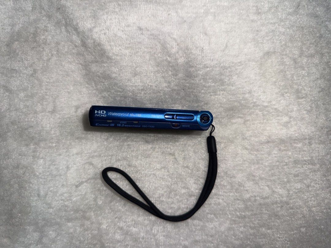 Sony Cyber-shot DSC-TX30 Blue Digital Camera (Category: Cameras) located in Manila. Submitted by jlcabangs (Listing ID 1465380233, Image 3). Description: - Model: Sony Cyber-shot DSC-TX30 Pocket Camera (Blue) - Resolution & Lens: 18.2 Megapixels with Carl Zeiss lens - Durability: Waterproof body, perfect for underwater and travel shots - Condition: Compact metal casing with minor scuff marks near the top edge from normal handling - Storage: Uses 