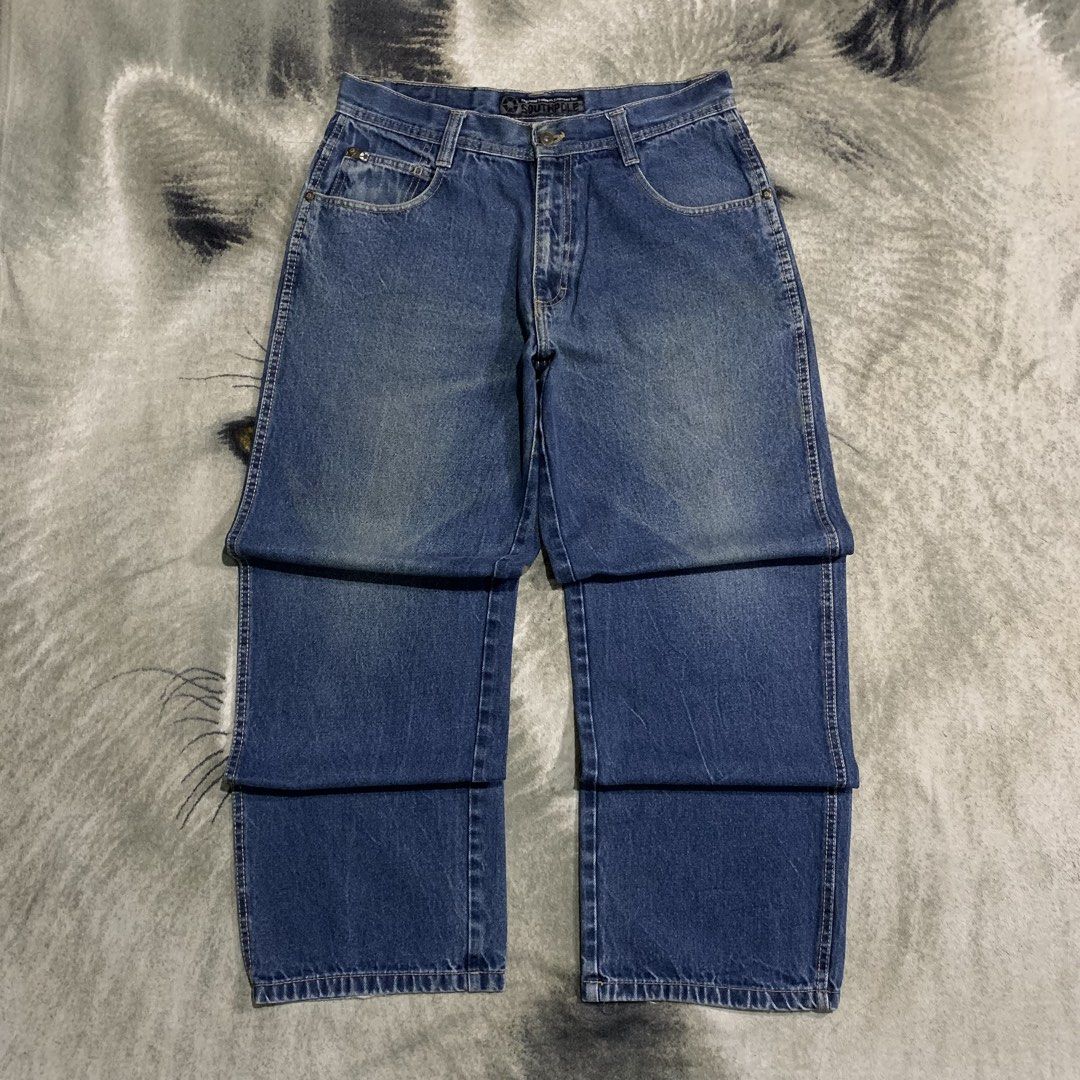 Southpole Blue Denim Jeans Size 36 (Category: Jeans) located in Bulacan. Submitted by puronghustlin (Listing ID 1465202299, Image 3). Description: - Brand: Southpole - Style: Classic 90s skater fit with wide legs - Size: 36 waist - Color: Medium blue wash with light fading at knees and hems - Details: Button fly closure, contrast stitching on back pockets, and branded leather patch on waistband.