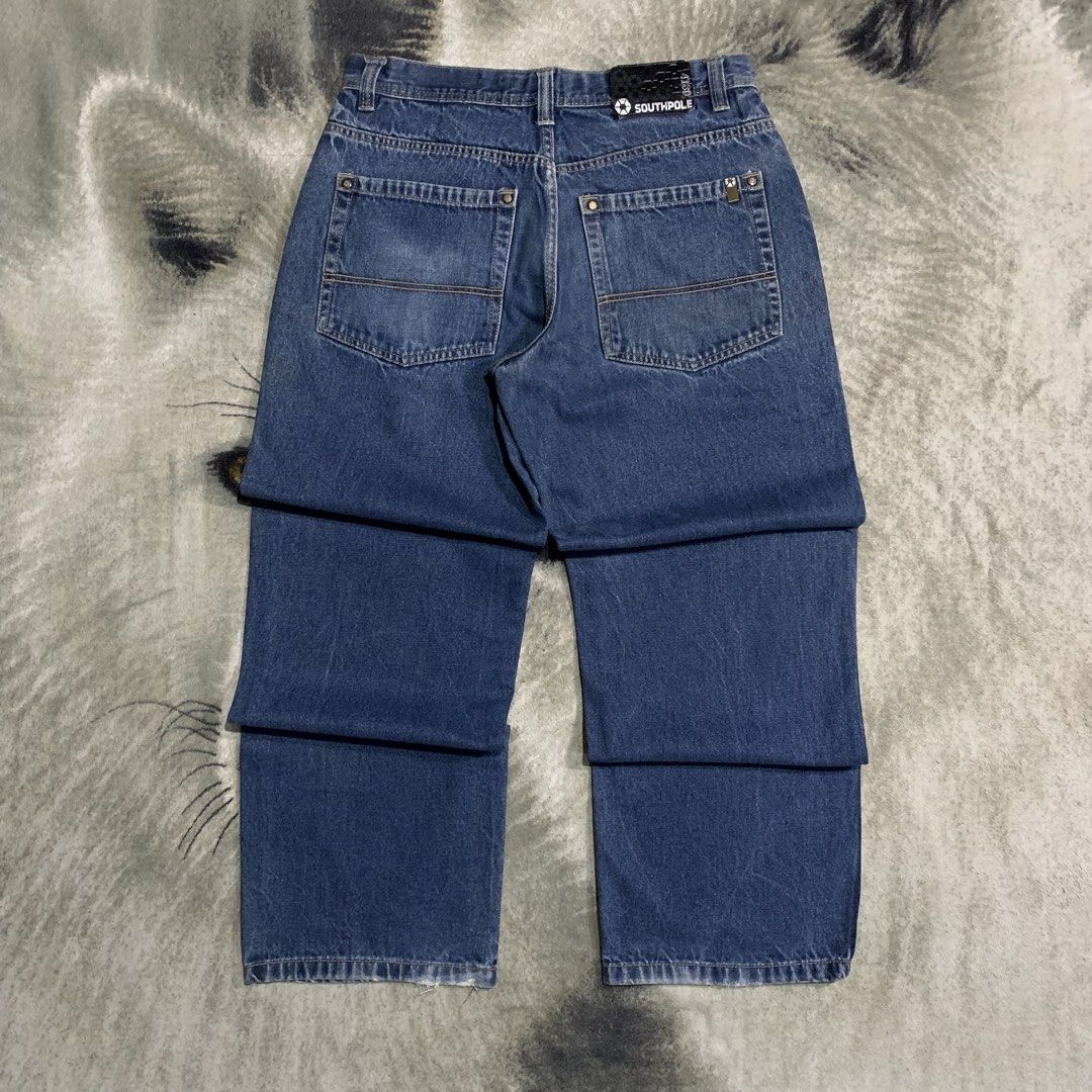 Southpole Blue Denim Jeans Size 36 (Category: Jeans) located in Bulacan. Submitted by puronghustlin (Listing ID 1465202299, Image 1). Description: - Brand: Southpole - Style: Classic 90s skater fit with wide legs - Size: 36 waist - Color: Medium blue wash with light fading at knees and hems - Details: Button fly closure, contrast stitching on back pockets, and branded leather patch on waistband.