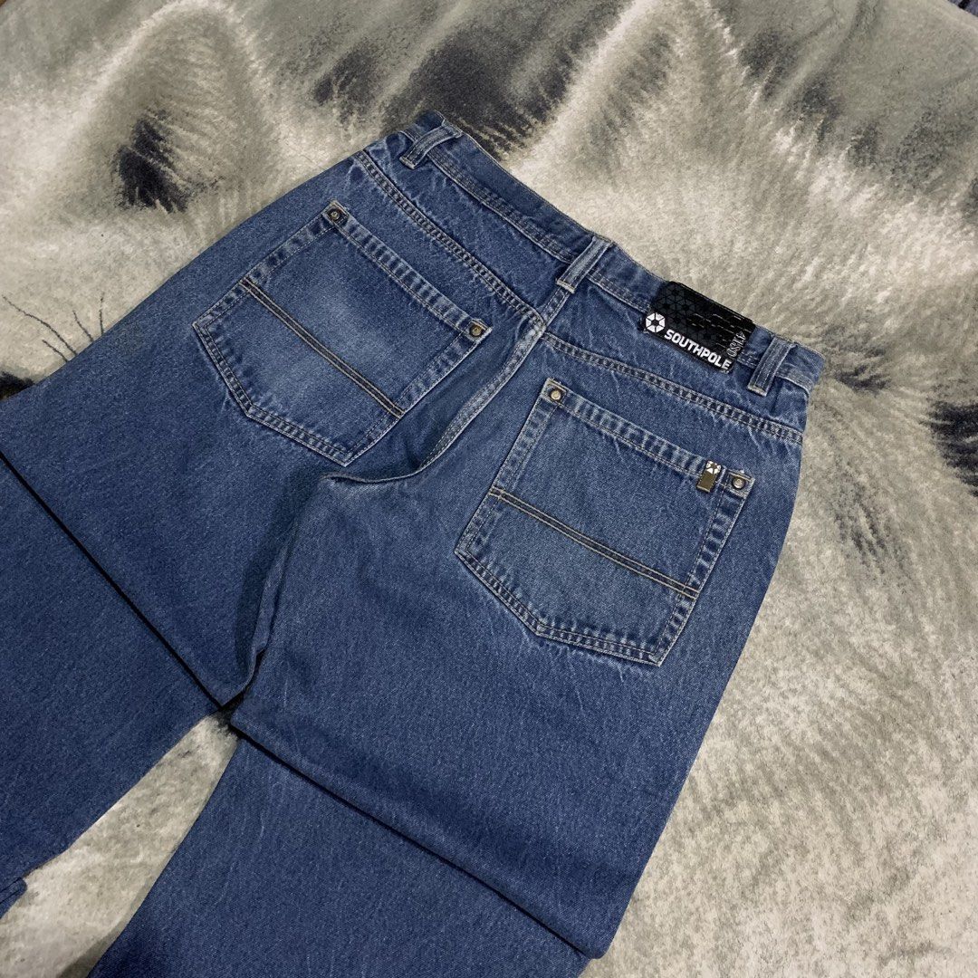 Southpole Blue Denim Jeans Size 36 (Category: Jeans) located in Bulacan. Submitted by puronghustlin (Listing ID 1465202299, Image 2). Description: - Brand: Southpole - Style: Classic 90s skater fit with wide legs - Size: 36 waist - Color: Medium blue wash with light fading at knees and hems - Details: Button fly closure, contrast stitching on back pockets, and branded leather patch on waistband.