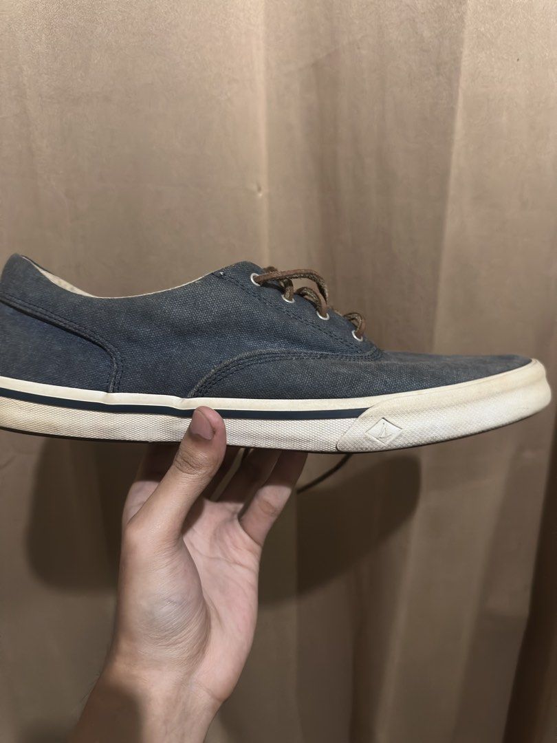 Sperry Top-Sider Canvas Sneakers Blue (Category: Sneakers) located in Quezon City. Submitted by bebe0827 (Listing ID 1465300515, Image 3). Description: - Brand: Sperry Top-Sider - Style: Low top canvas sneakers in dark blue denim-like fabric - Details: Brown leather laces with metal eyelets and iconic heel logo - Comfort: Cushioned striped insoles and durable white rubber midsole - Condition: Clean, well-maintained, and ready to wear - Location: 