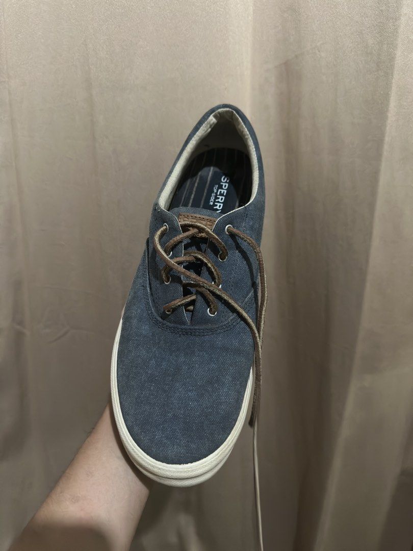 Sperry Top-Sider Canvas Sneakers Blue (Category: Sneakers) located in Quezon City. Submitted by bebe0827 (Listing ID 1465300515, Image 2). Description: - Brand: Sperry Top-Sider - Style: Low top canvas sneakers in dark blue denim-like fabric - Details: Brown leather laces with metal eyelets and iconic heel logo - Comfort: Cushioned striped insoles and durable white rubber midsole - Condition: Clean, well-maintained, and ready to wear - Location: 