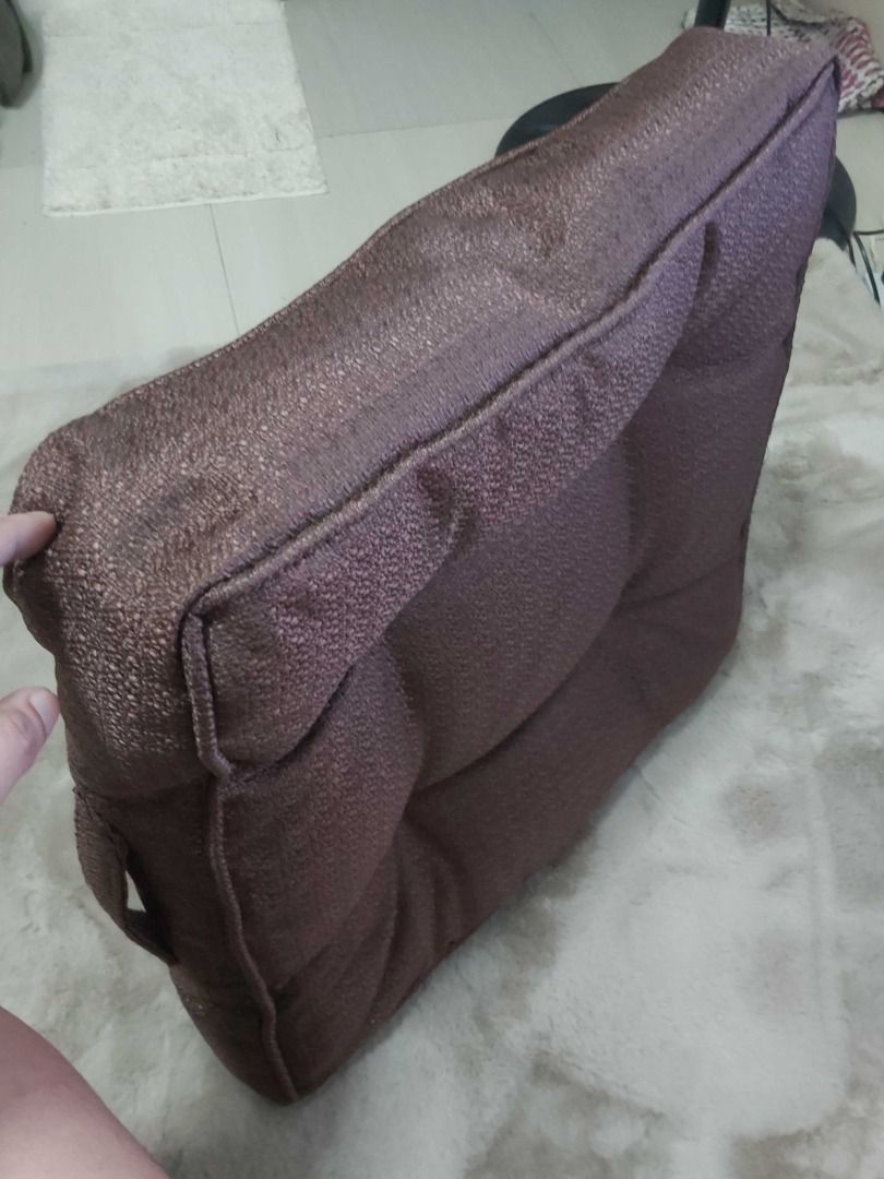 Square Tufted Brown Chair/Floor Cushion with Handle (Category: Cushions & Throws) located in Davao. Submitted by j_guitarist (Listing ID 1465230289, Image 2). Description: - Color: Brown - Size: 20x20x5 inches - Shape: Square with tufted buttons and piped edges - Features a built-in side carry handle for easy portability - Made with durable textured fabric - Plump and firm padding for optimal comfort - Versatile neutral tone ideal for dining chai