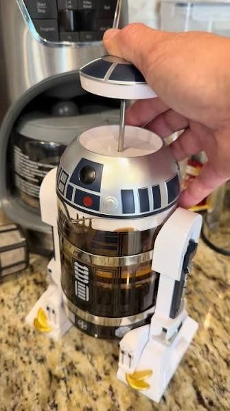 Star Wars R2-D2 French Press Coffee Maker (Category: Coffee Machines & Makers) located in Cebu City. Submitted by buddylimong (Listing ID 1465281258, Image 3). Description: - Official Star Wars R2-D2 themed coffee maker - Durable glass body wrapped in detailed R2-D2 robot housing - Features plastic legs and dome lid - Easy-to-use plunger mechanism pulls right through the top dome - Convenient front spout for easy pouring - Perfect functional kitc