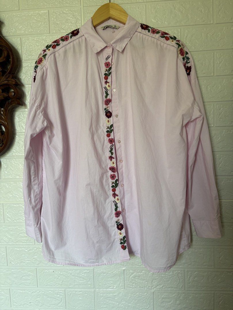 Stradivarius Pink Button Down 100%Cotton (Category: Blouses) located in Batangas. Submitted by purple_and_orange (Listing ID 1465183979, Image 1). Description: - Brand: Stradivarius - Color: Light pink with colorful floral embroidery along the placket and shoulders - Size: EUR L / USA L / MEX 30 - Fit: Relaxed fit with long sleeves and button cuffs - Condition: Great pre-loved staple piece with cute detailing.