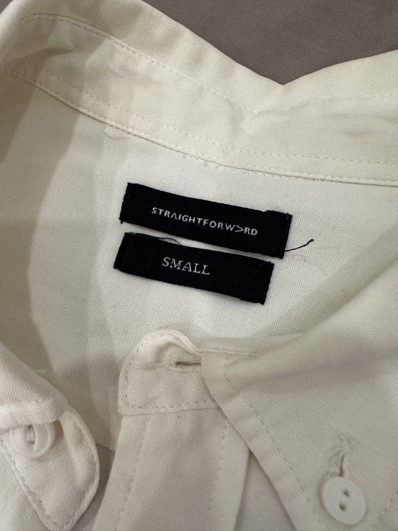 Straightforward White Long Sleeve Shirt (Category: Formal Shirts) located in Quezon City. Submitted by crslph (Listing ID 1465302171, Image 3). Description: - Color: White - Size: Small - Style: Classic collar, front button-down, buttoned cuffs - Condition: Good overall, with a small snagged thread near the upper back area - Versatile basic piece that easily matches any outfit.