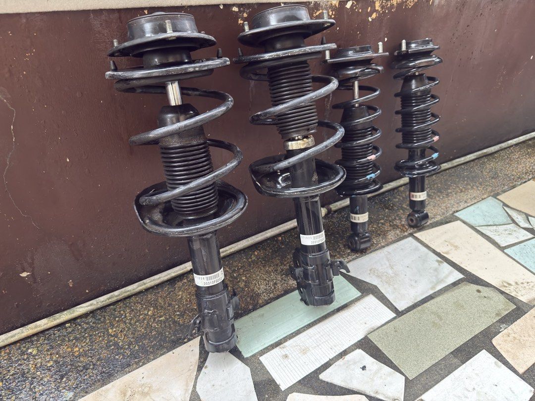 Subaru Impreza GH / GR Suspension Struts Set Front Rear (Category: Suspension Parts and Accessories) located in Manila. Submitted by puidex0916 (Listing ID 1465229335, Image 2). Description: - Complete set of 4 OEM suspension struts: front left, front right, and two rear units - Includes pre-attached springs and top mounts for easy installation - Verified part numbers clearly visible on stickers: 20310FG040, 20365FG020 - Removed from a fully work